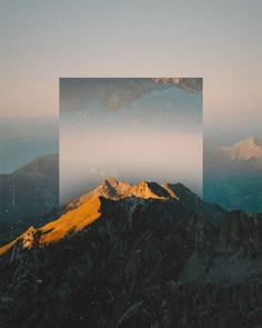 the mountains are covered in fog and low lying clouds, with a square frame over them