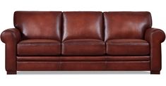 a brown leather couch sitting on top of a white floor