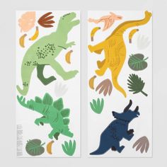 two stickers with dinosaurs and leaves on them