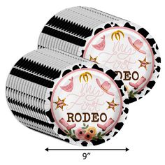 two round plates with black and white stripes, one has pink flamingos on it