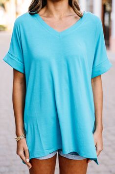 This versatile v-neck tee is here to make your life easy! It's honestly the perfect top for year round styling and layering. You can knot the hem or half tuck into your favorite jeans or shorts. You can layer it with all sorts of jackets, shackets, or kimonos. And don't even get us started on accessories! The options are absolutely endless! This top is truly a staple piece! This top features a v neckline, short cuffed sleeves, and a generous fit.Material has generous amount of stretch.Sydney is Mint Julep Boutique, Winter Layering, Mint Julep, Blue V, Staple Pieces, Cuff Sleeves, Kimonos, Fall And Winter, Ice Blue