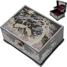 an elaborately decorated jewelry box is shown with its lid open and two drawers closed