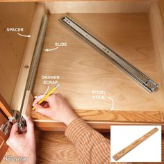 the drawer is open and there are some tools in it to make drawers look like they have been built