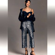 Anthropologie - The Colette Cropped Wide-Leg Sequin Pants By Maeve Polyester, Elastane; Viscose, Elastane Lining Zip Front Hand Wash Imported Size & Fit 11.5" Rise 24" Inseam 10.5" Leg Opening Elegant Silver Pants For Evening, Elegant Silver Sequined Pants, Metallic Sequined Pants For Spring, Spring Sequined Metallic Pants, Silver Sequin Evening Pants, Elegant Silver Party Pants, Silver Bottoms For Spring Evening, Silver Sequined Pants For Night Out, Silver Evening Bottoms For Spring