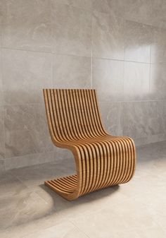 a wooden chair sitting on top of a tile floor next to a wall and window