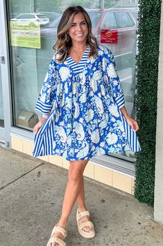 Wrap yourself in the vibrant energy of this Paisley Print Wide Sleeve V-Neck Short Dress! Featuring a unique paisley print and wide sleeves, this dress will make you stand out in the crowd. The v-neck highlights your neckline while the short length adds a flirty touch. Perfect for adding some excitement to your wardrobe! Model is 5'4'' And Wearing A Small Purse Essentials, Buddy Love, Vibrant Energy, Wide Sleeves, Short Dress, Paisley Print, Shoe Brands, Blue Dresses, Paisley