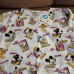 Disney Extra Large Top. Brand New With Tags! Themed White Tops With Character Print, Disney White Tops With Character Print, Fun White Mickey Mouse Tops, Christmas Scrub Tops, Disney Anniversary, Disney Tank Tops, Christmas Scrubs, Acid Wash Shirt, Disney Tanks