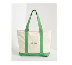 NEW  GUESS  CANVAS TOTE BAG GUESS LOGO PRINT DESIGN CREAM IN COLOR WITH GREEN ACCENTS  MEASURES 19 X 13  INCHES  A NICE SIZE TO CARRY YOUR BOOKS, CLOTHES ETC. ZIPPER TOP CLOSURE TO KEEP YOUR ITEMS SECURE FRONT SLIP POCKET ****CHECK OUT MY OTHER DESIGNER BAGS FOR SALE**** ALL ITEMS COME FROM A SMOKE-FREE ENVIRONMENT AND ARE 100% AUTHENTIC LOCATION: RACKFRD1223 Summer Bag With Logo And Double Handle, Summer Double Handle Bag With Logo, Summer Bags With Logo And Double Handle, Green Shoulder Bag With Logo, Green Logo Shoulder Bag, Green Shoulder Bag With Logo For Daily Use, Green Tote Bag With Logo, Casual Summer Bags With Logo, Green Everyday Bags With Logo