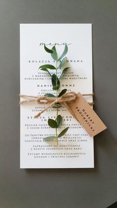 the wedding stationery is tied up with twine