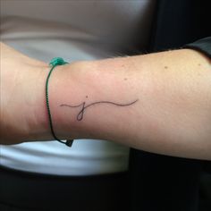 a person with a small tattoo on their arm