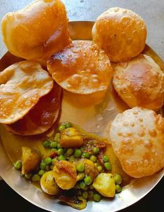 a plate with some bread and peas on it