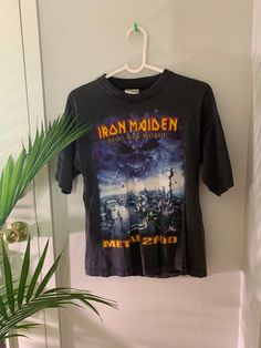 "Condition: Vintage 2000s Iron Maiden tee M. In good condition. Some wear. Tiny hole on the back. Good streetwear Measurements  Size: M Chest: 19\"                                      Length: 24\"  - No refunds or Exchanges. - You may privately massage me if you need further clarification on any items." Distressed Y2k Crew Neck T-shirt, Y2k Distressed Crew Neck T-shirt, Y2k Distressed Cotton T-shirt, Distressed Y2k Crew Neck Top, Y2k Distressed T-shirt For Streetwear, Iron Maiden T Shirt, Concert Tees, Band Shirts, Iron Maiden