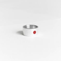 Symbol of sun - red circle on the white background. It's first association with Japan. Sun in Japan is symbol of honourable Imperator. We took leadership and strength from this meaning and put into this ring. Combination of red and white is combination of clearing energy of the sun and prime purity. On the other side of the ring is hieroglyph of the sun 太陽.  New autumn/winter collection! Gift for all who loves minimalism and simplicity of japan culture. Details:  Width: 10 mm Thickness: 1.2 mm Materials: sterling silver 925, enamel The surface has structure that does not cling or scratch. Please read my shipping and policies tab for shipping info.  All items are packaged in moisture resistant packaging to ensure they arrive in perfect condition. Don't hesitate to contact me with any questi Modern Red Ruby Ring, Modern Red Open Ring, Minimalist Red Ruby Ring, Modern Red Ruby Ring In Sterling Silver, Red Minimalist Sterling Silver Ring, Minimalist Red Sterling Silver Ring, Minimalist Red Open Ring, Minimalistic Ring, Japanese Sun