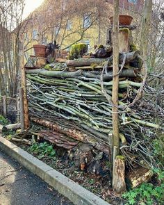 a pile of branches sitting on the side of a road