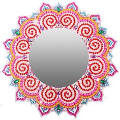 a circular mirror with colorful designs on it