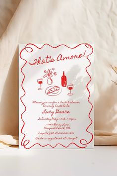 a red and white wedding card with an image of a bottle of wine on it