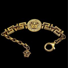 Vintage Signed Rare Versace Rhinestone Medusa Bracelet Vintage Gianni Versace's Iconic Gold-Toned Medusa, Surrounded By Clear Crystals. Stamped Versace On The Back. Fits Up To A 9.5" Wrist. It Also Has A Medusa Head At The End. The Ideal Accessory To Complement Any Look Or Layer! Size: Can Go To 9 1/2'' Condition: Good Vintage; A Small Area On The Side Of The Medallion Has Plating Wear And Some Overall Metal Wear. Era: Circa 1980s Signed: Versace (Made In Italy) Please Look At All The Photos, As They Are Part Of The Description. I Try My Best To Point Out Any Flaws. Also Please Remember This Is A Preloved Piece And May Show Signs Of Light Wear, Marks, Scratches, Etc. I Will Be Posting A L Medusa Bracelet, Versace Bracelet, Filigree Bracelet, Versace Jewelry, Medusa Head, Versace Accessories, Victorian Gold, Bracelet Vintage, Clear Crystals