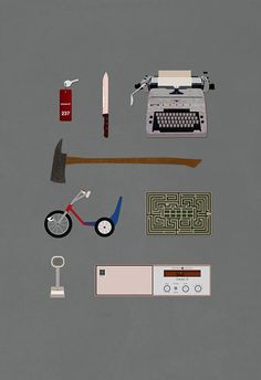 an assortment of items are arranged on a brown background, including a typewriter and scissors