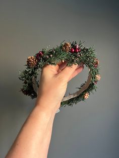 Listing is for one Halo. Tieback Halo Flower Crown with assorted dried juniper greenery with red berries with some mini pinecones mixed in. Greenery is mounted on Natural Floral wire and backed with felt for comfort. Headband is adjustable . Perfect for all your Holiday Photo shoots coming up. Each piece is custom made and no two are 100% alike. If you are not seeing something that you are looking for, please convo me for a custom order. Would be happy to accommodate custom orders if I am able t Juniper Flower, Greenery Crown, Mini Pinecones, Christmas Wedding Flowers, Christmas Headpiece, Christmas Crown, Newborn Crown, Crown Halo, Baby Flower Crown