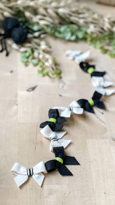 black and white paper flowers on a wooden table