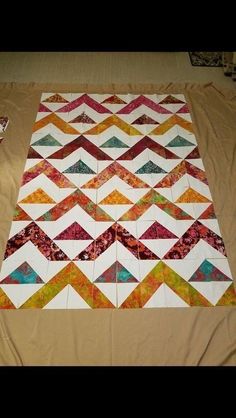 the quilt is laying on top of the tablecloth and ready to be sewn