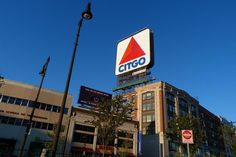 a large sign on the side of a building that says citgo in front of it