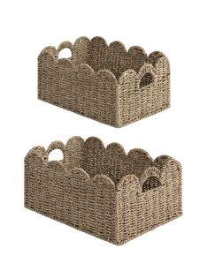 two baskets with handles on each side and one has an oval hole in the middle