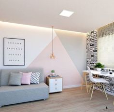 a living room with a couch, table and chairs next to a painting on the wall