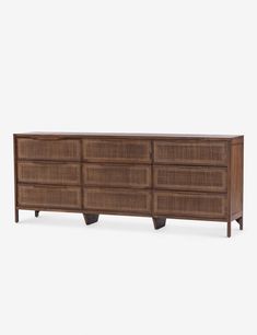 the sideboard is made out of wicker and has four drawers on each side