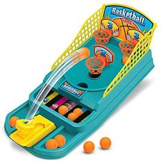 this is an image of a toy basketball game with balls in front of the machine