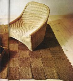 a woven chair sitting on top of a wooden floor