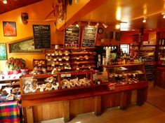 the inside of a restaurant with many items on display