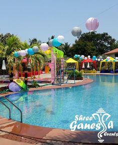 an empty swimming pool with colorful decorations around it