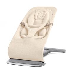 a baby seat that is on top of a stand