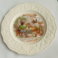 a plate with an image of two people sitting at a table