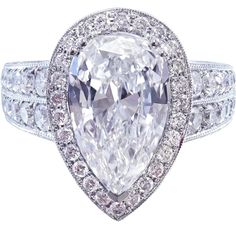 an oval cut diamond ring with two rows of diamonds around the band, surrounded by round brilliant