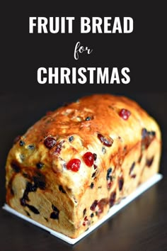 a loaf of fruit bread sitting on top of a white plate with text overlay