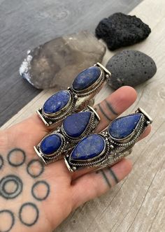 Unique statement large Lapis Lazuli stone rings. Each ring has a unique set of stones for you to choose from. As you can see, there is a number that represents each ring for you to pick your favorite. In one of the pictures you can see the dimensions of the biggest one and the smallest one, all the rest are in between. They are also size adjustable, the smallest size recommended is size 9.5, and can be open up to size 12-13 , it might create a gap in the back of the ring. A unique comfy statemen Bohemian Open Ring Jewelry With Large Stone, Bohemian Open Ring With Large Stone, Bohemian Rings For Jewelry Making With Stone Setting, Bohemian Adjustable Rings With Stones, Adjustable Bohemian Rings With Stones, Nickel-free Bohemian Ring Jewelry, Bohemian Adjustable Crystal Ring With Large Stone, Bohemian Crystal Open Ring With Large Stone, Bohemian Rings With Large Stone For Gift