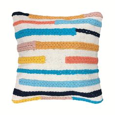 a multicolored striped pillow on a white background