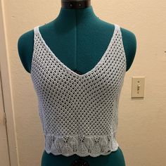 Cropped Tank Top Light Blue Size M New With Tags 100% Acrylic Hand Wash Blue Sleeveless Top With Crochet Trim, Casual Blue Crochet Lace Top, Fitted Blue Crochet Top With Open Knit, Light Blue Open Knit Summer Top, Blue Sleeveless Knit Crochet Top, Fitted Blue Crochet Knit Top, Blue Fitted Crochet Knit Top, Fitted Blue Knit Crochet Top, Fitted Blue Tops With Crochet Trim