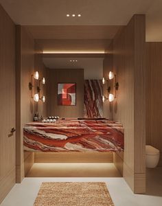 a bathroom with marble counter tops and wooden walls, along with lights on the ceiling