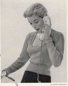 an old photo of a woman talking on the phone while holding a cell phone to her ear