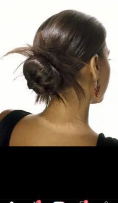 an image of a woman with her hair in a low bun hairstylisted