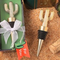 two cactus bottle stoppers in a gift box