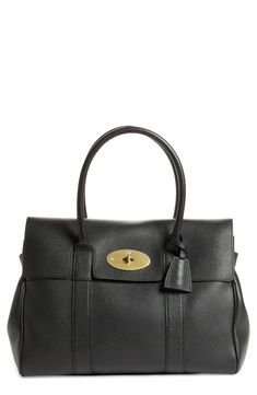 A beautifully structured pebbled-leather satchel features curvy rolled top handles, a neatly notched front flap and a gleaming, logo-etched turnlock. A spacious interior provides plenty of room for storing all of your daily essentials. Style Name:Mulberry Bayswater Pebbled Leather Satchel. Style Number: 6167385. Luxury Satchel With Fold Over Clasp And Double Handle, Leather Satchel With Fold Over Clasp, Leather Satchel With Fold Over Clasp And Top Handle, Leather Top Handle Satchel With Fold Over Clasp, Classic Evening Satchel In Pebbled Leather, Designer Satchel With Fold Over Clasp And Top Handle, Designer Top Handle Satchel With Fold Over Clasp, Luxury Black Satchel With Rolled Handles, Classic Satchel With Rolled Handles