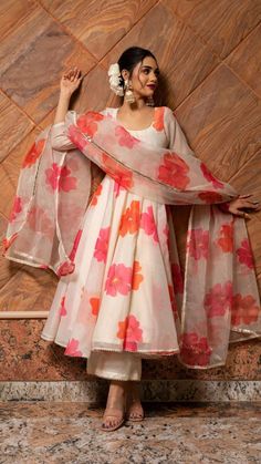 PRODUCT DESCRIPTION: Anarkali : Chanderi Pant: Cotton silk Dupatta: Organza Color: off white with orange and pink printed flowers. work : Gotta lace work, stone work embellishment all over dupatta No. Of Components : Set of 3 Wash Care : Dry Clean Customization : Only Size and Length Of Product SKU#: 11403219WH Disclaimer: All our pieces are handcrafted in our manufacturing unit .We Ensure that our pieces are shot professionally under controlled lighting. Colours tend to be perceived differently Printed Anarkali Suits, डिजाइनर कपड़े, Trendy Outfits Indian, Anarkali Dress Pattern, Traditional Indian Dress, Salwar Kamiz, Indian Dresses Traditional, Traditional Indian Outfits, Indian Gowns