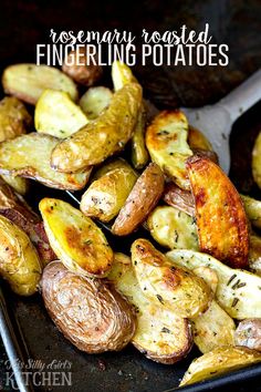 roasted fingerling potatoes in a baking pan with a spatula on the side and text overlay