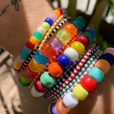 colored and white seed bead striped bracelets strung on elastic please gently roll on and off to prolong its life handmade in venice, ca Rainbow Stripes, Light Orange, Blue Stripes, Live Lokai Bracelet, Rainbow Colors, Seed Beads, Light Blue, Stripes, Rainbow