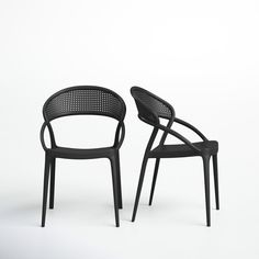 two black chairs sitting next to each other