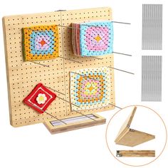 a wooden peg board with two crocheted squares hanging from it's sides